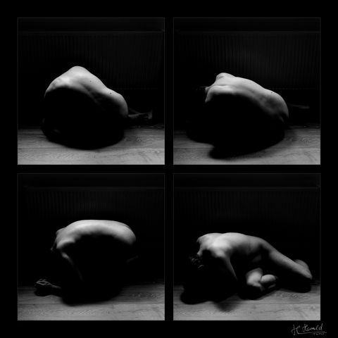 A collage of four square black and white images of a nude man crouched on the ground, with light from above illuminating mainly his back.