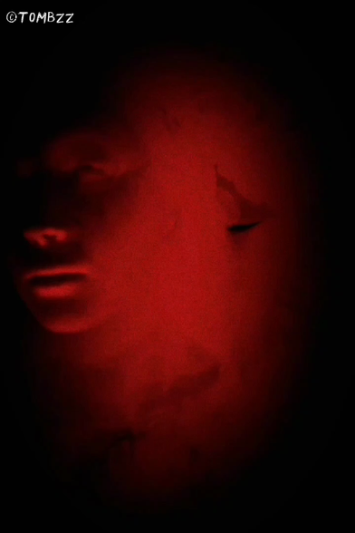 A series of abstract frames in dark and red tones serve as a visual prologue. Then, distorted, unsettling faces emerge from the red, appearing to materialize from the depths of the image, intensifying the sense of mystery. In subsequent scenes, a hooded figure appears—its eyes glow ominously in the darkness, drawing attention and building tension. The sequence concludes with the stylized text ‘The End’ on a dark background, summarizing the dramatic and eerie visual message. The hypnotic atmosphere of the video is complemented by the dark, industrial music of **∆AIMON – ‘Choke’**, whose pulsing sounds enhance the tension and mystery.