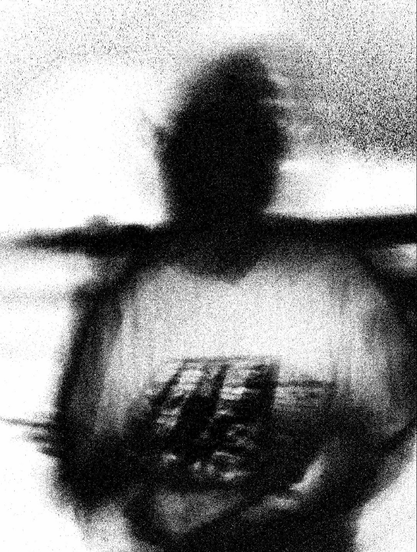 black and white photo of as person over processed for a grainy effect 