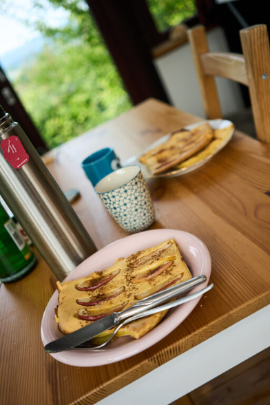 a breakfast table with apple and cinnamon pancakes