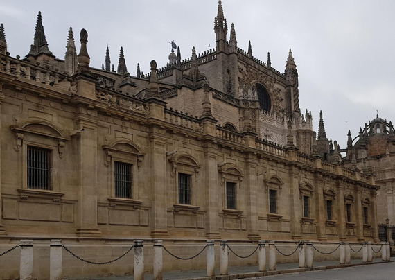 Barred windows in the side facade of the Cathedral of Seville - Spain.