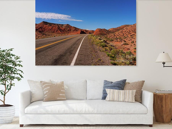 A sneak peak of the snow covered peaks of Mt Pennell of the Henry Mountain range as it peaks over some orange sandstone rock mound formations. Highway 95 also called Utah State Route 95 curves through the cool sandstone formations @fineartamerica 
https://5-jennifer-white.pixels.com/featured/highway-95-peak-of-mt-pennell-jennifer-white.html
#buyintoart #fineart #photography