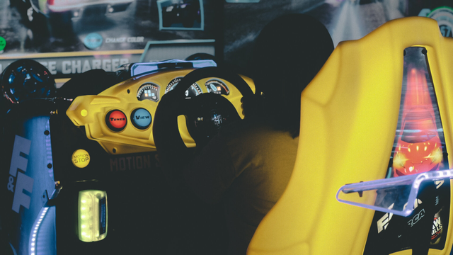 A yellow neon racing arcade game