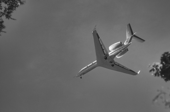 low flying airplane approaching a runway