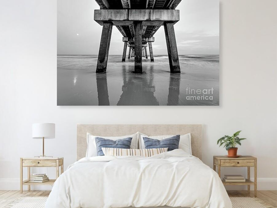 Standing under the Gulf State Park Pier on a peaceful evening along the Alabama Gulf Coast in Gulf Shores, Alabama, United States. This long exposure black and white photograph captures the movement of the water flowing up onto the shoreline and splashing around the pillars. 
https://5-jennifer-white.pixels.com/featured/dusk-under-the-gulf-state-park-pier-grayscale-jennifer-white.html
#buyintoart #fineart #photography #artforsale
