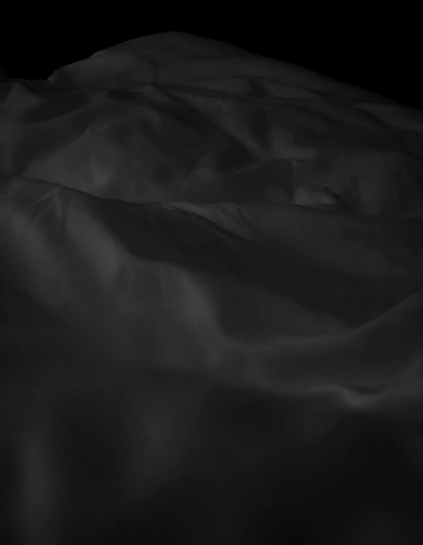 Dark, low-light image showing rumpled white fabric with folds and creases. 