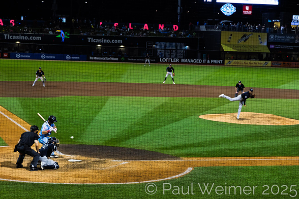 Minor league at bat, showing pitcher, catcher, batter