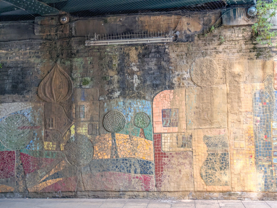 A mosaic of buildings fields and towers