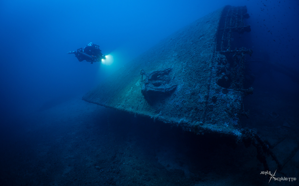 Scuba diver at the bow of the wreck SS Brioni