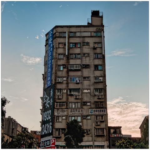 Free-standing residential building at dusk.