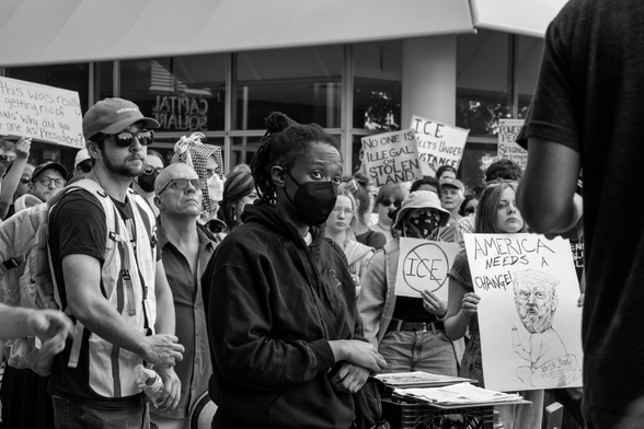 Black and white image of an ICE protest in Des Moines, Iowa. 