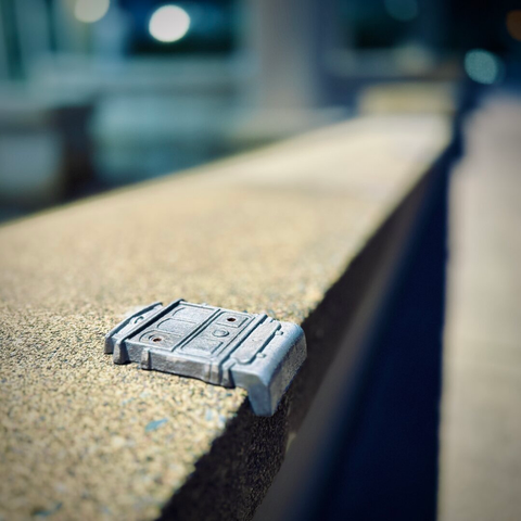 A perspective view shows a metallic streetcar design screwed down to the concrete ledge beneath it in the foreground and more blurred out down the ledge in the distance.