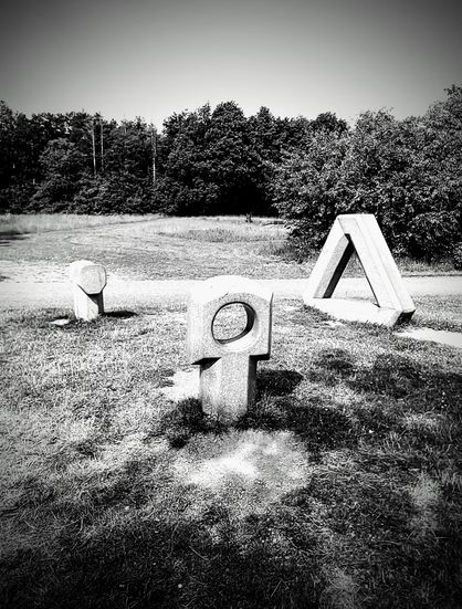 three rather abstract forms in park