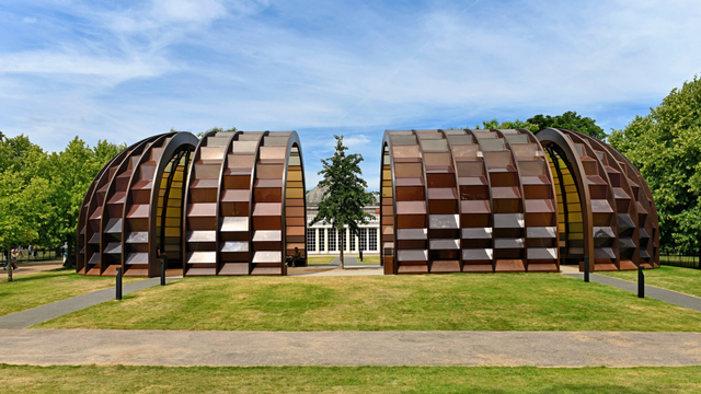 Photo of this year's pop-up pavilion designed by Marina Tabassum (b.1969, Dhaka, Bangladesh). Called 'A Capsule in Time', it is constructed of timber and translucent brown polycarbonate panels. By the Serpentine South, City of Westminster, London.