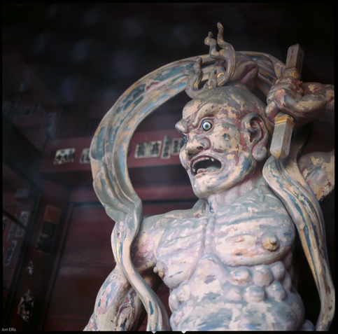 colour photograph of one the Nio (guardian kinds). there is typically a pair of these at the entrance to a temple - one mouth open - Agyō, another mouth closed - Ungyō.

they represent overt violence and latent strength, respectively.