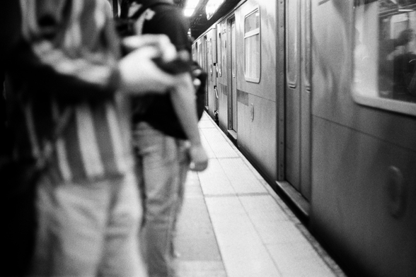 Lex Ave express train arrives, heading downtown, Grand Central Terminal. May 23, 2025, about 5pm.

Camera: Canonflex 35mm SLR (1959). Lens: 50mm f/1.8, Film: Tri-X 400 (at 1600). Exposure 1/30 at f/2. N+2 dev/scan by the Darkroom Lab.