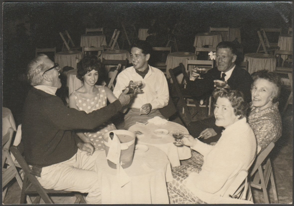 Monochrome photograph showing a view of half a dozen holidaymakers at an unspcified venue in Lloret de Mar on the Costa Brava.

Photo by Foto R Llores, San Pedro, 15, Lloret de Mar, No 4, 26 September 1961.

Very good condition, with light silvering to corners and small light bend to top right corner.