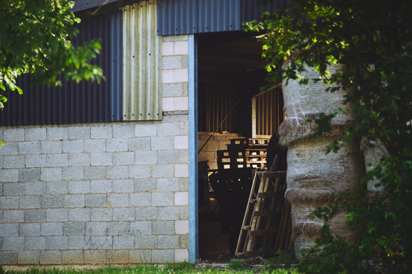 a hay store with hay bales and palettes