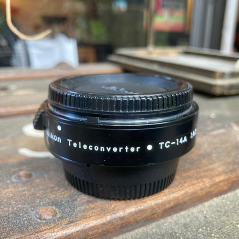 It's a Nikon TC-14A teleconverter.

iPhone Photo.