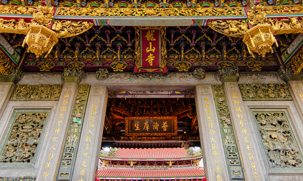 Richly decorated upper part of a temple entrance.