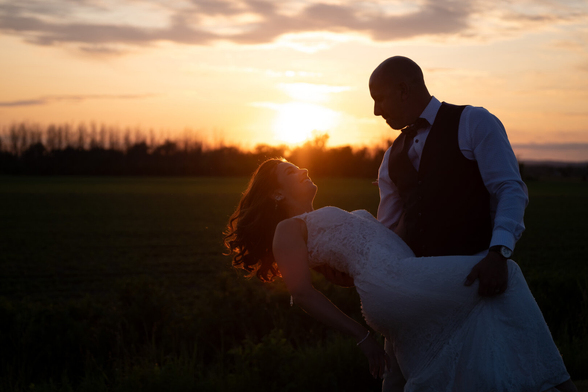 Picture of a newlywed couple on sunset.