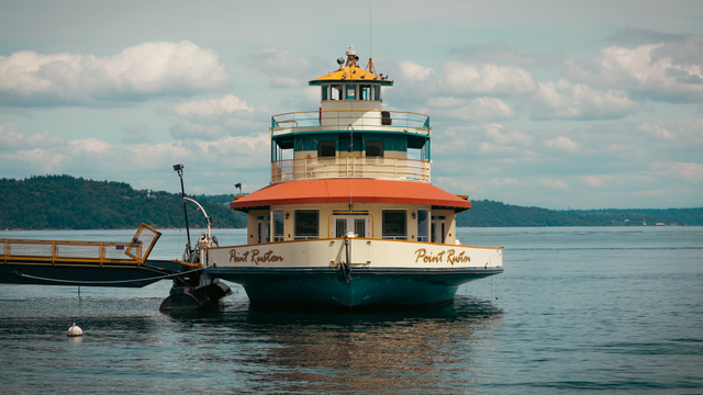 a large docked boat with text on the side reading "Point Ruston"