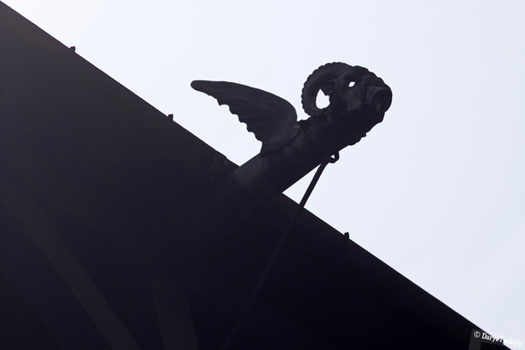 A gargoyle protruding out of the roof in Cardiff Castle. 