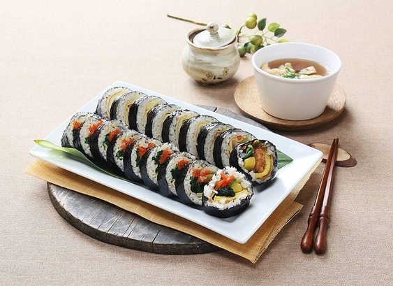 Gimbap, a Korean dish made from cooked rice, vegetables, fish, and meat.