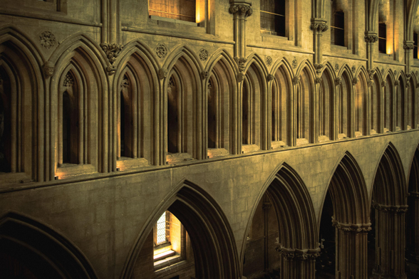 Detail of the north side of the Cathedral nave showing the triforium, a series of small arched windows, above the main arches at ground level.