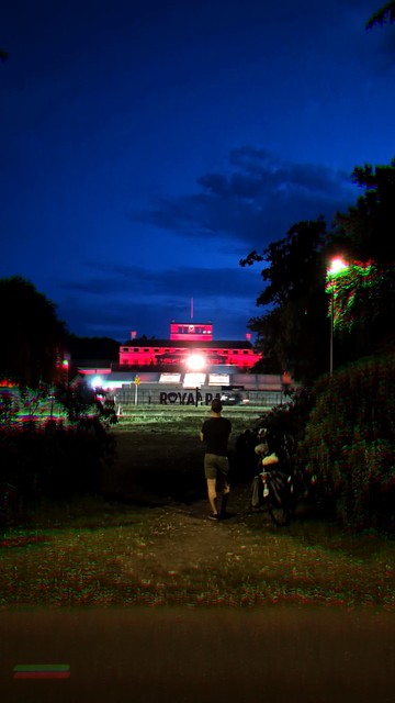 Animated gif of someone standing outside a Kraftwerk concert.