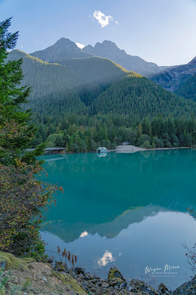 Diablo Lake North Cascades National Park Washington

Diablo Lake, nestled within Washington's North Cascades National Park, is a striking reservoir renowned for its vibrant turquoise waters. This distinctive hue results from glacial flour—fine rock particles produced by surrounding glaciers—that remains suspended in the water, reflecting sunlight and creating the lake's signature color. The lake was formed in 1930 following the construction of Diablo Dam along the Skagit River, serving as a key component of the Skagit River Hydroelectric Project managed by Seattle City Light.

Easily accessible via the North Cascades Highway (State Route 20), Diablo Lake offers visitors a range of recreational activities. The Diablo Lake Trail, a moderately challenging 7.6-mile roundtrip hike with an elevation gain of approximately 1,300 feet, provides hikers with panoramic views of the lake and surrounding peaks.



Image:
https://fineartamerica.com/featured/morning-diablo-lake-north-cascades-national-park-washington-vertical-wayne-moran.html

Read more:
https://waynemoranphotography.com/blog/pacific-northwest-photography-adventure-a-journey-through-natures-masterpieces/

#DiabloLake #NorthCascades #NationalPark #Washington #Nature #travel #travelPhotography #Landscape #landscapes #art #fineart 

#ayearforart #buyintoart

