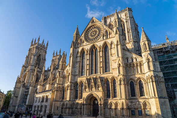 Evening Light York Minster York England

Historical and Architectural Context

York Minster, officially known as the Cathedral and Metropolitical Church of Saint Peter, crowns the historic city of York. Its origins stretch back to a wooden church built in 627 AD for the baptism of King Edwin of Northumbria. Over the next several centuries, it evolved into a stone Norman cathedral around 1080 before entering its most iconic phase of development: the Gothic masterpiece begun in 1220 under Archbishop Walter de Gray. This transformation spanned roughly 250 years, birthing the majestic nave, the soaring central tower, the ornate quire, and the luminous Great East Window often dubbed the "Sistine Chapel of Stained Glass"—a breathtaking mosaic of over 300 panels completed by 1408
Ilkley Brickwork.

Remarkable engineering feats, like the central tower constructed atop medieval foundations and the self-supporting octagonal Chapter House, showcase the masons' genius. Even today, stone-carving apprentices continue this centuries-old tradition from the Stoneyard, keeping time-honored techniques alive . 

Image:
https://fineartamerica.com/featured/evening-light-york-minster-york-england-wayne-moran.html

Read more:
https://waynemoranphotography.com/blog/your-best-itinerary-to-see-the-most-of-england/

#YorkMinster #York #England #church #cathedral #architecture #travel #travelPhotography #Landscape #landscapes #art #fineart 

#ayearforart #buyintoart
