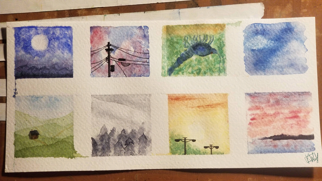 Photo of 8 small watercolor paintings spaced out in a 2 by 4 grid on a single piece of paper. They are mostly landscapes & skies, with one upside-down painting of a blue freshwater shrimp.