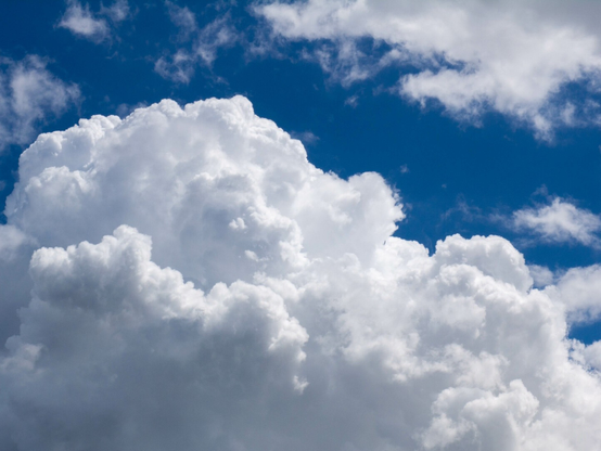 Masses of fluffy cloud in a blue sky. Some more tenuous weolcan sheets lurk around the edges.