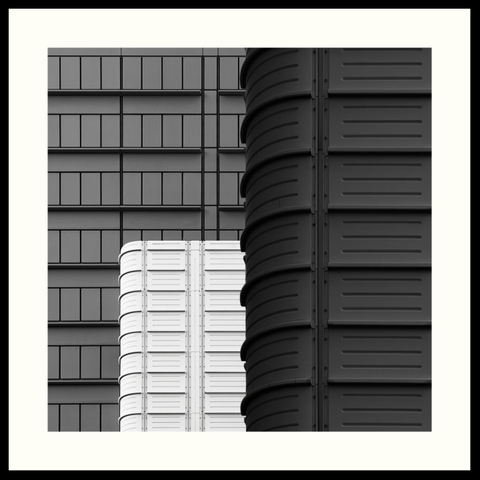 b&w - A close-up of the 'KB National Library of the Netherlands' (Koninklijke Bibliotheek) in The Hague. Pictured are three parallel sections of this modern building at different depths. The framing creates a minimalistic and somewhat abstract image, emphasising the only three gray tones present and the vertical and, at places curved, horizontal lines.