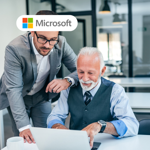 A person smiling while working on their laptop and another person next to them leaning on their shoulder depicting Microsoft. 