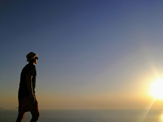 me standing on a cliff watching sunset