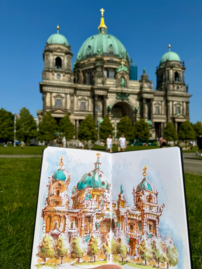 Urban sketch in ink and watercolor drawing of the cathedral in Berlin. It has a big dome in the middle and two towers with smaller domes on both sides. The roofs are turquoise, with gold ornaments on top, the building itself is ochre and golden brown. There are trees in front of the cathedral. Height of the building is about 100 meters.