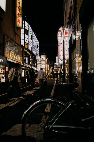 photo of a busy street in Shinjuku at night