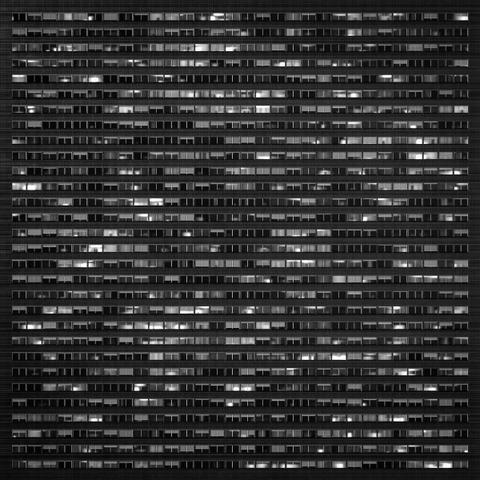 A 3d render of a large office or apartment block with hundreds of windows in black and white.
