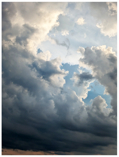 ai-assisted alt text:

	
Dramatic sky with large, dark gray storm clouds partly obscuring the sun. Patches of blue sky and some lighter, fluffy clouds are visible through gaps, creating a dynamic and moody atmosphere.