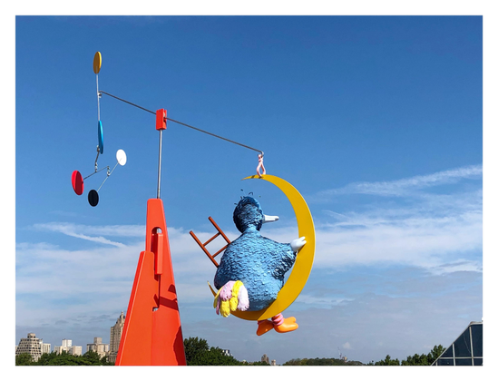 Another view of the sculpture, with the mobile elements rotated so that we see Big Bird from behind as he gazes into the distance. From this angle we can see the fluffy pink and yellow feathers of his tail.