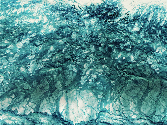 A regular sea foam created by waves. Colors are inverted and color graded with cyan color, to match with sea colors.