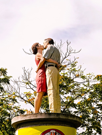 Two column saints: a man and a woman embracing and kissing. Unfortunately, there is no same-sex counterpart.