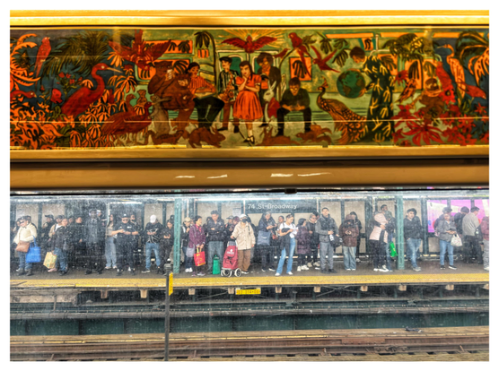 Snapshot through the grimy window of a NYC subway train, showing a crowd of people standing and waiting on the opposite platform. A sign behind them reads “74 St-Broadway.” Above the window, on the train’s interior wall, is a piece of commissioned subway art (by Marcel Dzama) showing a fantastical scene of commuters standing or sitting inside a train while surrounded by lush vegetation and wild animals: peacocks, parrots, bears, rabbits, etc. The artwork and the real-life scene below it mirror each other in a striking way.