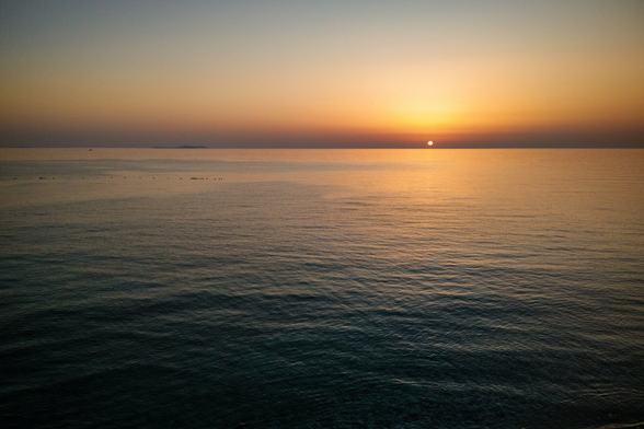 Image of a sunset over the sea.