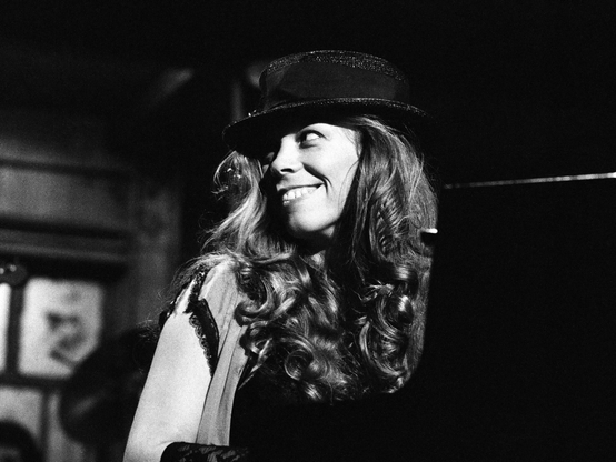 black and white candid shot of rickie lee jones on stage at saturday night live. 