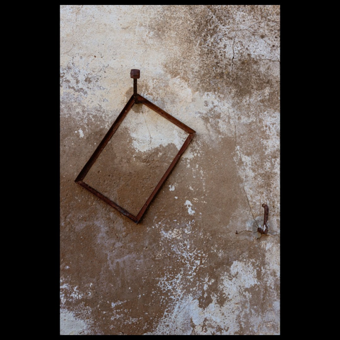 Wall with some metal elements hanging on it