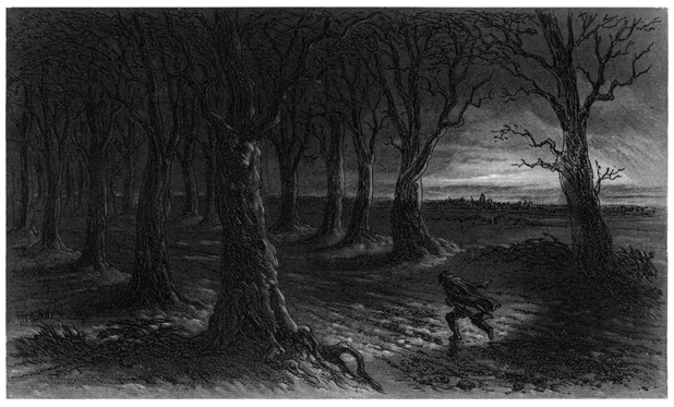 A man walks against the wind at night along a road lined with leafless trees.