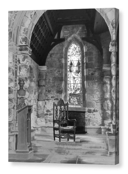 Black and white portrait photograph of a wooden chair in an old church.  The image is shown printed upon a block canvas.